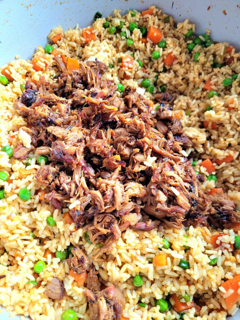 Make smoked pork fried rice at home thatโs better than takeout! This is a pork fried rice recipe with leftover pork, veggies, and savory sauce.. plus my cheat rice hack if you forgot to make rice the day before.