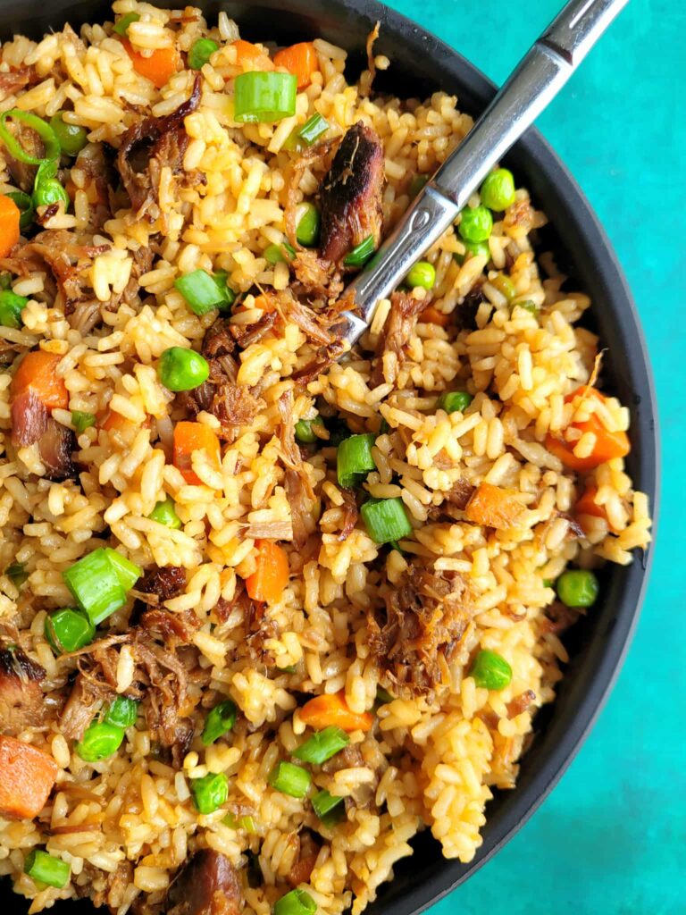 Make smoked pork fried rice at home thatโs better than takeout! This is a pork fried rice recipe with leftover pork, veggies, and savory sauce.. plus my cheat rice hack if you forgot to make rice the day before.