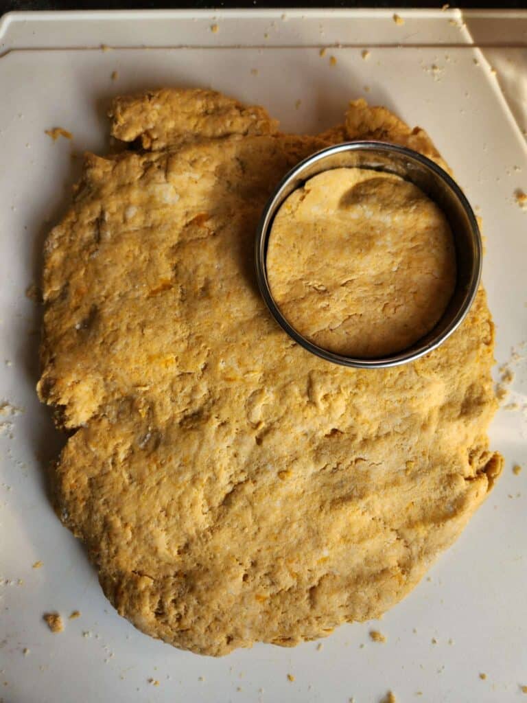 cutting biscuits out of dough