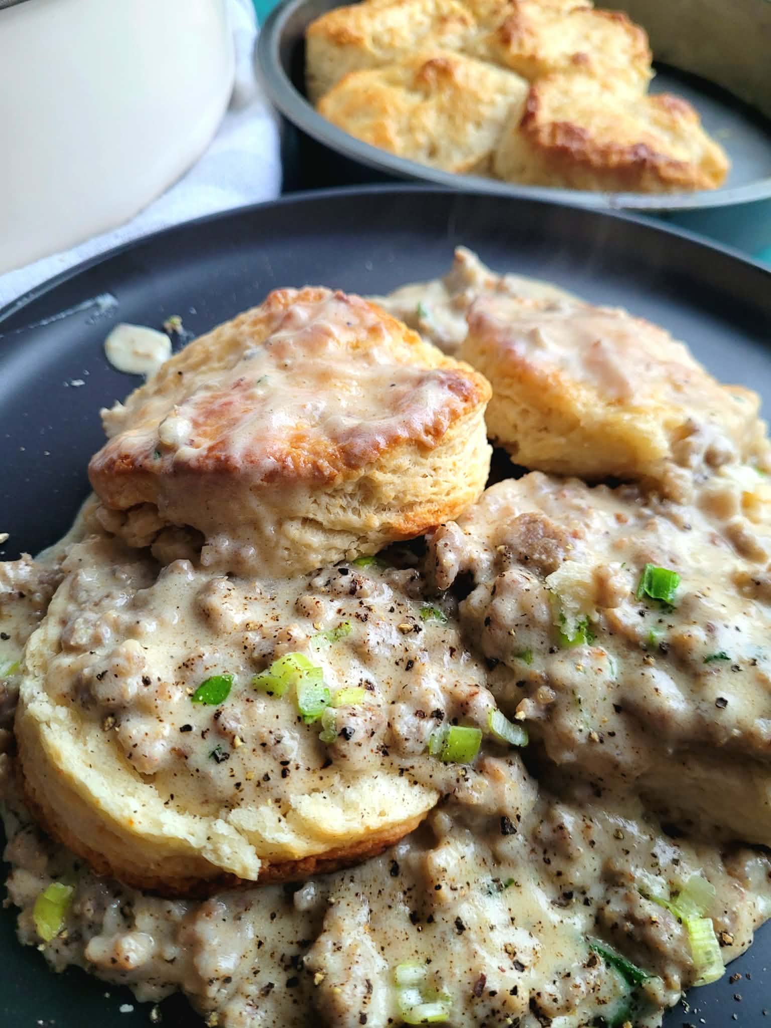 split homemade buttermilk biscuits and gravy