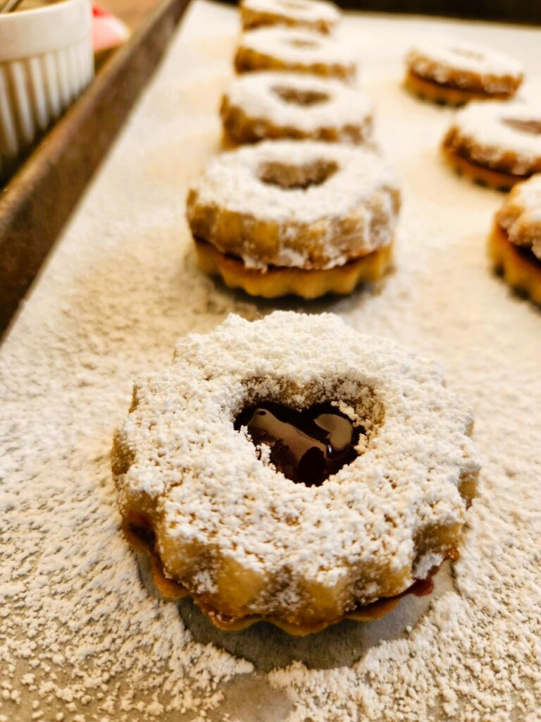 linzer cookies on a baking sheet