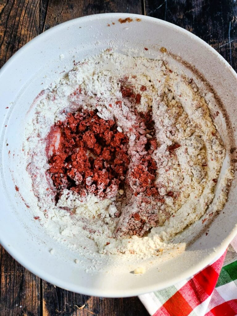 adding dry ingredients to wet ingredients for red velvet cookies