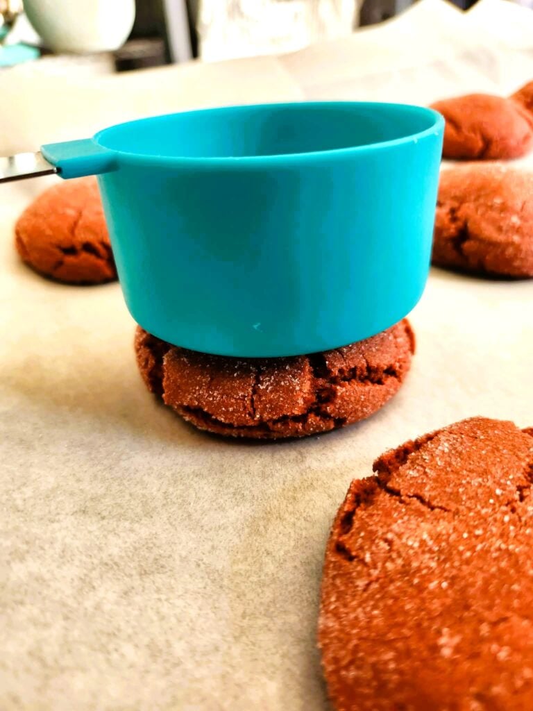 flattening out cookies just out of the oven