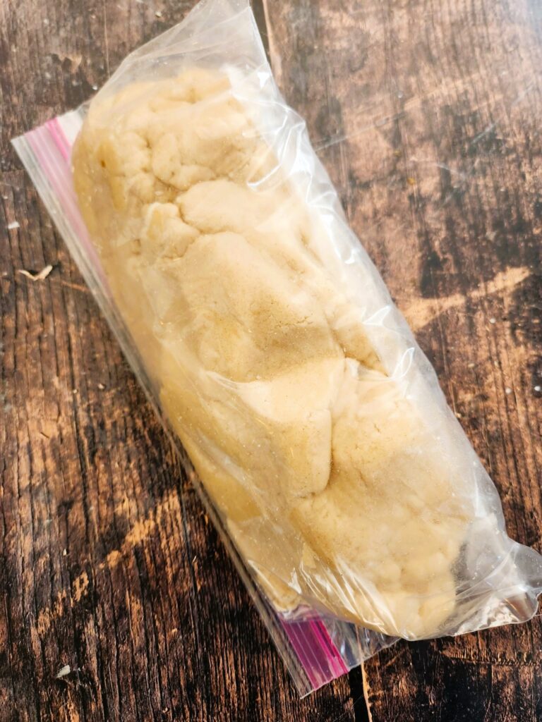 adding linzer dough to a zip bag to chill for 1 hour