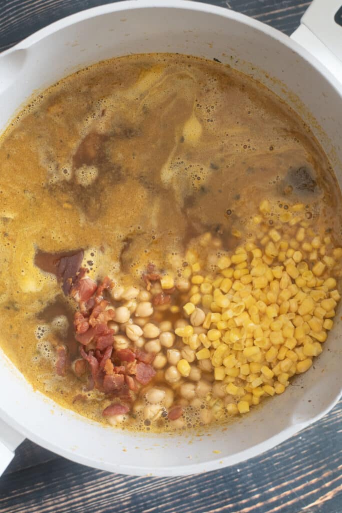 adding bacon beans and corn to ham bean soup