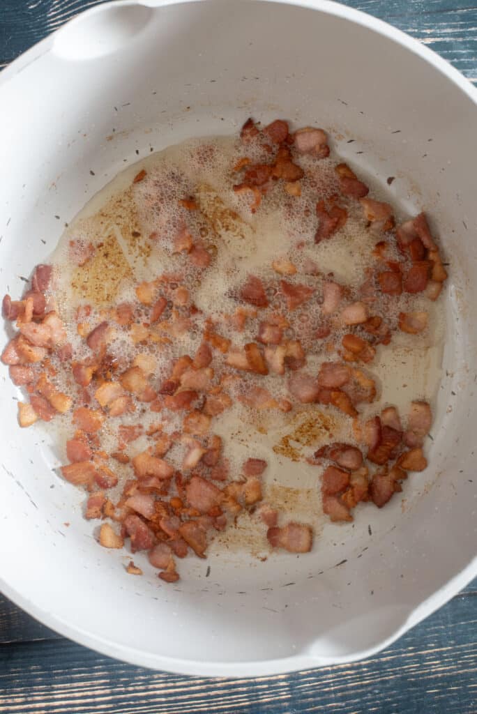 rendering bacon in a big pot