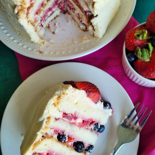 This Berry Chantilly Cake recipe uses vanilla cake mix, fresh berries, almond flavor, and mascarpone whipped cream frosting for a soft, bakery-style layer cake perfect for spring, Easter, or special occasions.