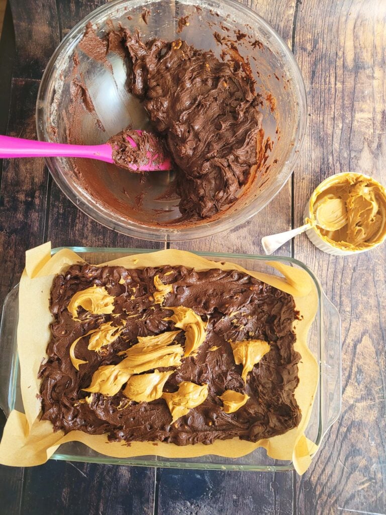 adding glops of peanut butter for swirling