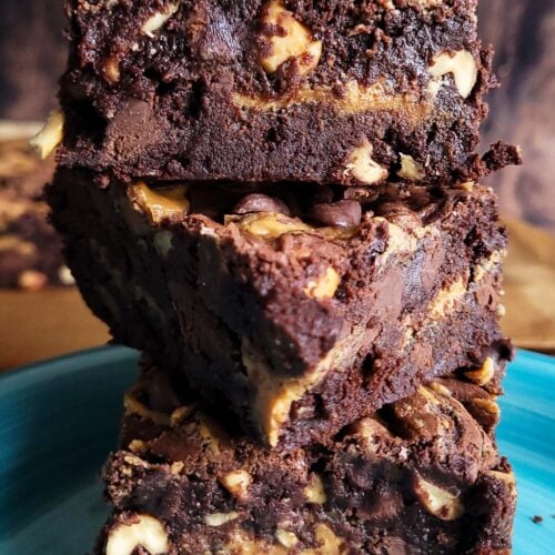 Stack of peanut butter chocolate brownies highlighting thick, chewy layers and swirled peanut butter ribbons