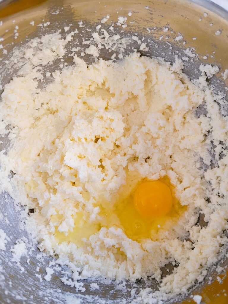 adding egg to butter for cookies