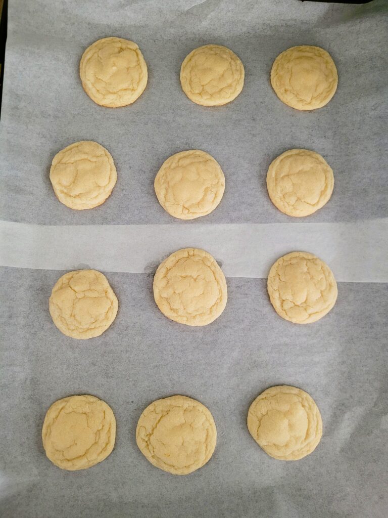 baking sheet pan full of sugar cookies resting