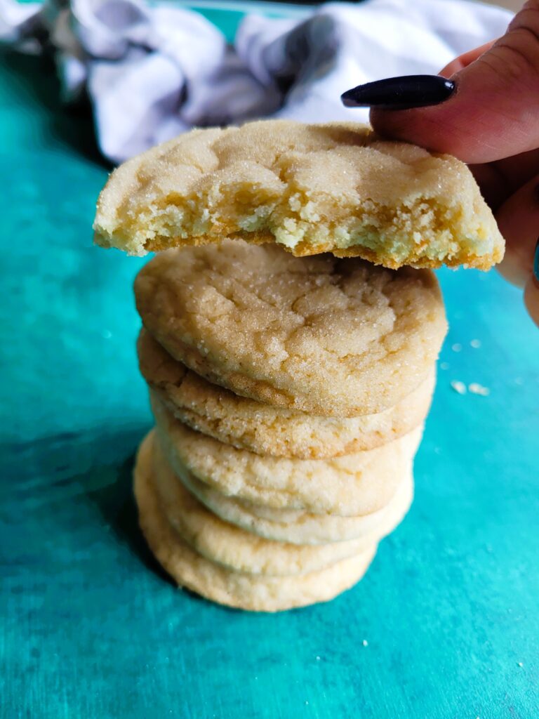 Close-up of bakery-style sugar cookies showing soft centers and crackly sugar tops