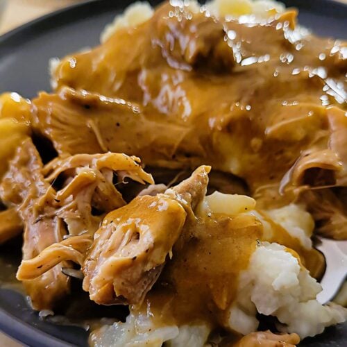 These tender country style pork ribs are smothered in rich onion gravy and served over creamy mashed potatoes for the ultimate comfort food dinner.