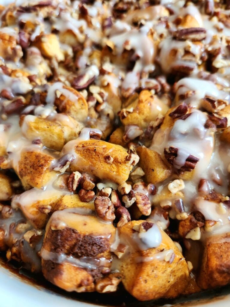 Golden baked apple cinnamon roll casserole with tender apples and pecans